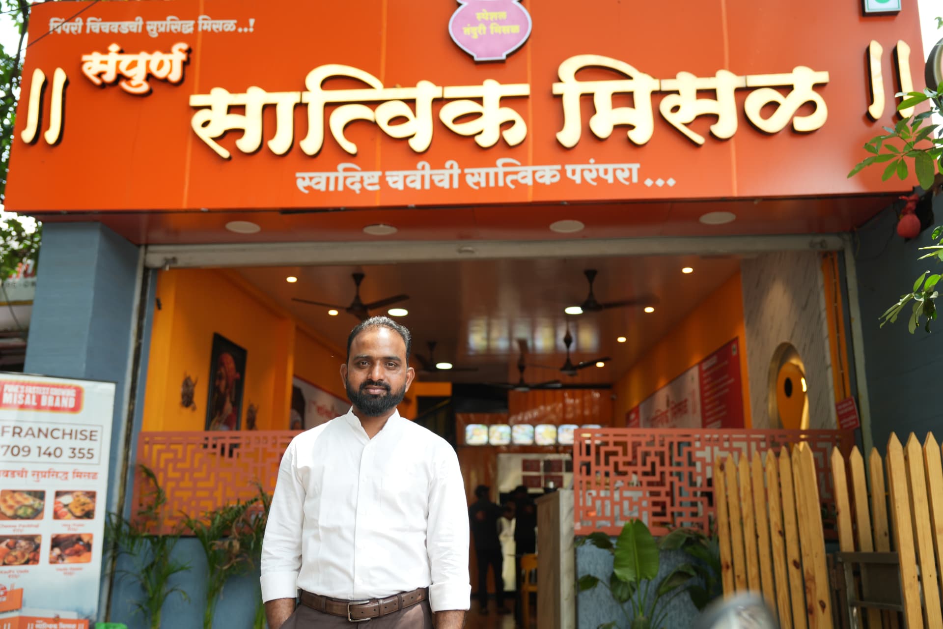 Nitin Rathod, founder of Sampurna Satvik Misal, outside a franchise outlet