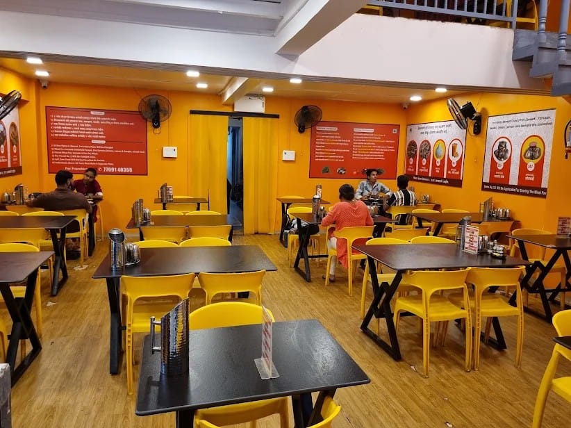 Customers dining inside a Sampurn Satvik Misal outlet
