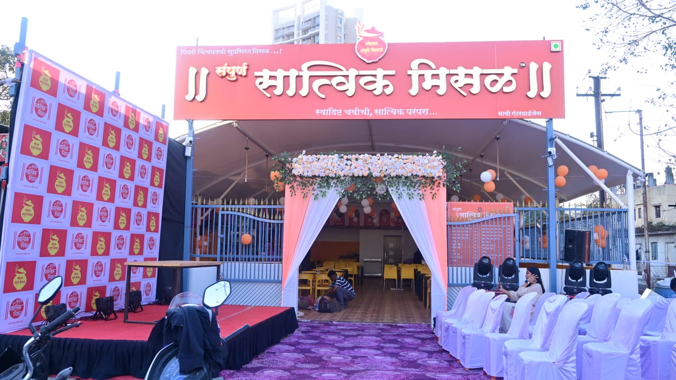 Sampurn Satvik Misal outlet with a tented seating area and branded backdrop
